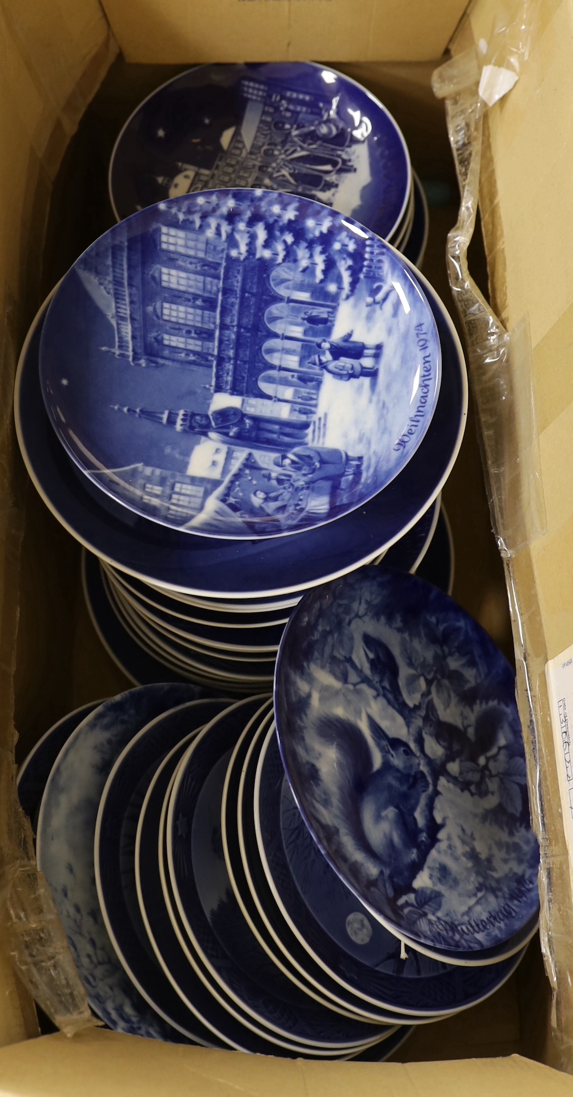 A large quantity of Royal Copenhagen Christmas plates and other plates